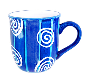 Blue Mug: A blue patterned mug isolated on a white background.