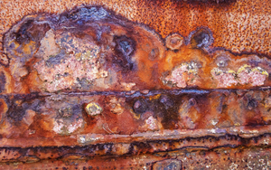 Abandoned Boat Grunge 2: Detail of rusting hulk abandoned on a salt marsh.