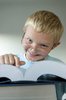 Homework Kid: Cute kid with large educational reference books