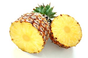 Pineapple: Fresh pineapple sliced in half