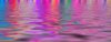 Rainbow Reflections: Banner of lights reflecting in water in warm carnival colours. Makes a great background, texture or fill.
