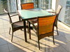 Outdoor Furniture: Outdoor table and chairs on a tiled inner city balcony in evening sunlight.