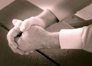 Praying Hands 3: A man's hands clenched in prayer. Duotone.