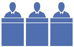 Panel of Judges 2: A pictogram of a panel of judges seated at a bench or office workers seated at desks. Could represent power, preachers or government.