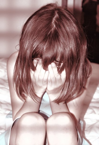 Victim 3: A young girl in tears.