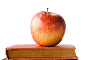 Apple on books: apple on a pile of books