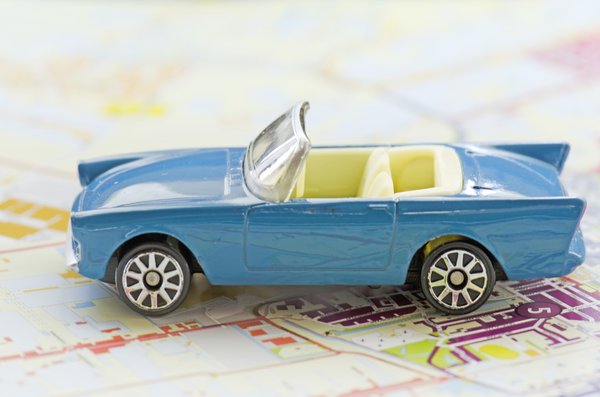 Car on map: Toy car on road map